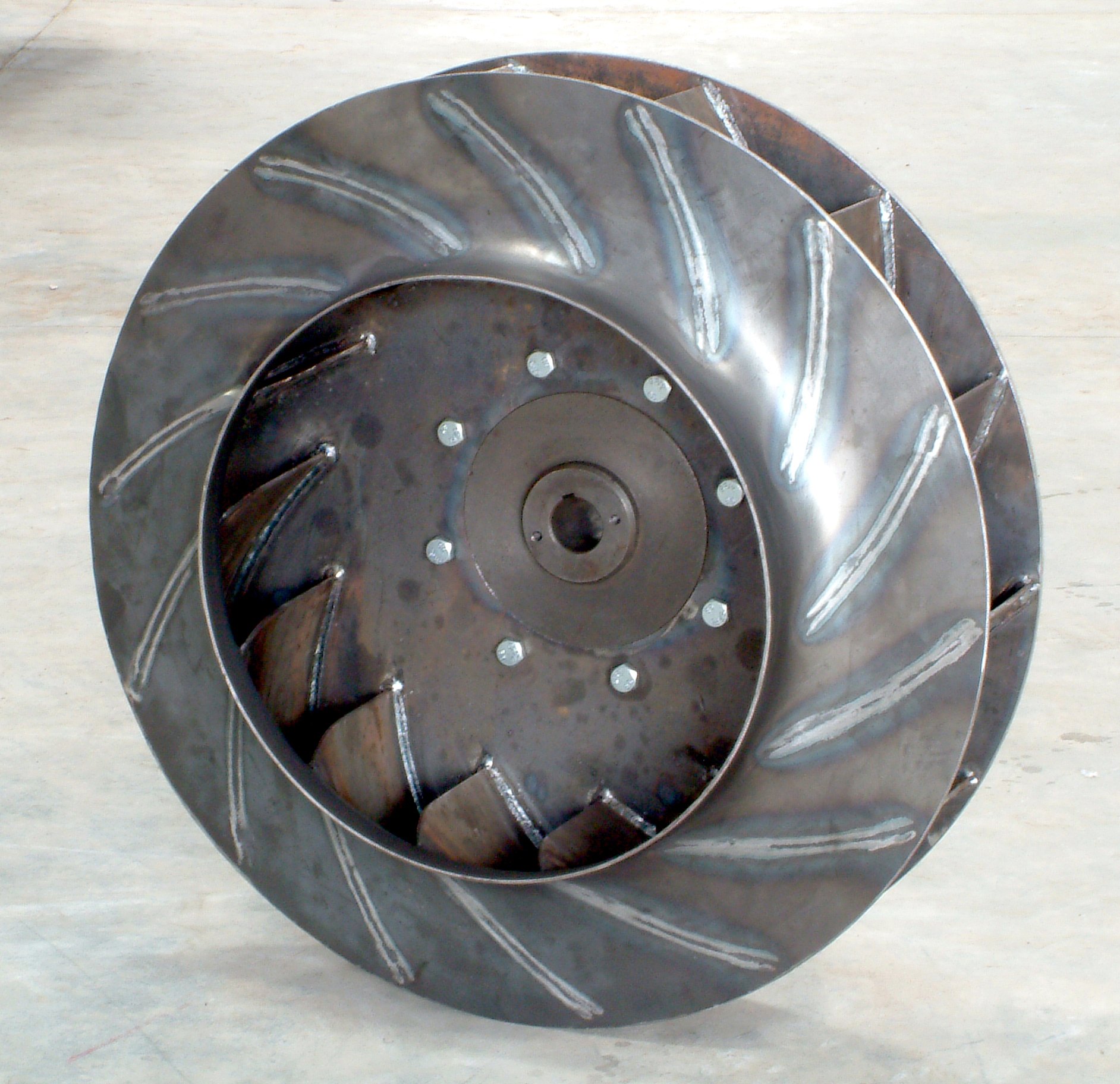 Weld beads on a fabricated centrifugal impeller before finishing