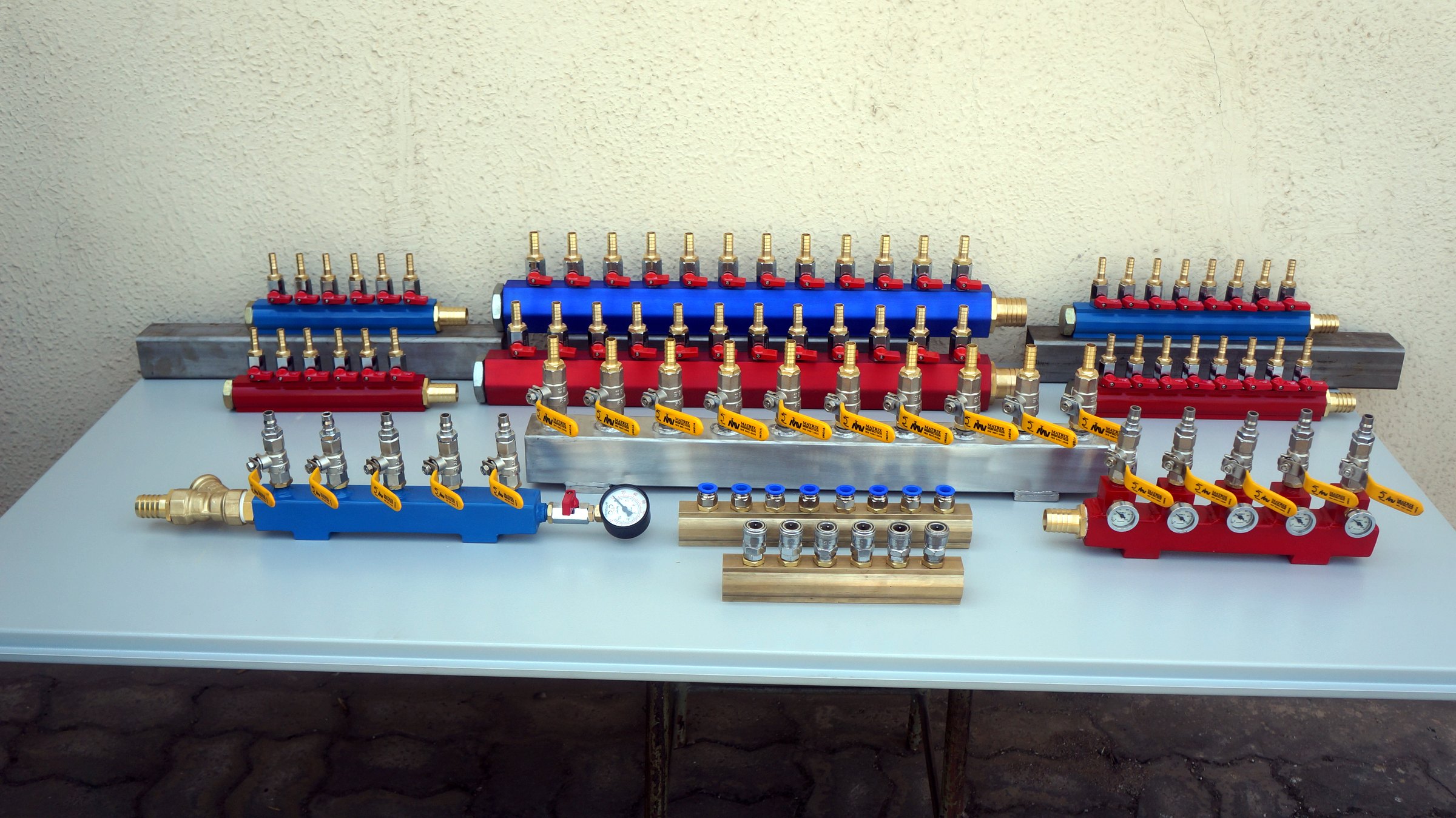 Water manifolds in brass, stainless and painted steel, in a range of port counts